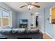 Spacious living room with hardwood flooring, comfortable seating, and open access to adjoining areas at 6982 78Th N Ave, Pinellas Park, FL 33781