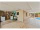 Spacious outdoor patio with laundry hookups and wall art at 6982 78Th N Ave, Pinellas Park, FL 33781