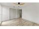 Bedroom featuring contemporary flooring, neutral walls, modern ceiling fan, and closet at 7400 Belvedere Ter, New Port Richey, FL 34655