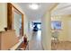 Hallway view from the front door to the living room and kitchen at 7700 Sun Island S Dr # 105, South Pasadena, FL 33707