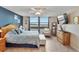 Bright main bedroom featuring a beautiful water view, ceiling fan, and tile floors at 7700 Sun Island S Dr # 105, South Pasadena, FL 33707