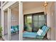 Inviting waterfront patio with comfortable seating, perfect for relaxing and enjoying the view at 7700 Sun Island S Dr # 105, South Pasadena, FL 33707
