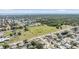 High angle shot displaying a neighborhood with scenic views of fields, parks, and the ocean in the distance at 8956 124Th Way, Seminole, FL 33772