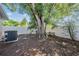 Backyard featuring a large, mature tree providing shade and greenery at 8956 124Th Way, Seminole, FL 33772