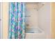 Bathroom featuring a tub with white tile surround and a colorful shower curtain with sea life designs at 8956 124Th Way, Seminole, FL 33772
