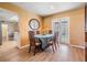 Charming dining area with wood floors, french doors and a view of the exterior at 8956 124Th Way, Seminole, FL 33772