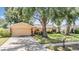 Lovely one-story home with a well-kept lawn, mature trees, and a convenient two-car garage at 8956 124Th Way, Seminole, FL 33772