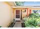 Inviting front entrance with decorative details and vibrant landscaping at 8956 124Th Way, Seminole, FL 33772