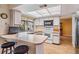 Kitchen with a breakfast bar and updated appliances at 8956 124Th Way, Seminole, FL 33772
