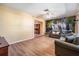 Spacious living room with hardwood floors and a decorative accent wall at 8956 124Th Way, Seminole, FL 33772