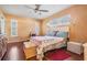 Bright main bedroom features hardwood floors and natural light at 8956 124Th Way, Seminole, FL 33772