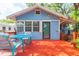 Outdoor space on the back deck with a dining table, chairs and small beverage station at 904 E Patterson St, Tampa, FL 33604