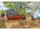 An exterior view from the backyard shows the spacious back deck and verdant yard space at 904 E Patterson St, Tampa, FL 33604