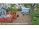 Spacious backyard showcasing the outdoor deck, patio, firepit and mature landscaping at 904 E Patterson St, Tampa, FL 33604