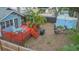 Aerial backyard view with deck, patio area, and shed with lush landscaping at 904 E Patterson St, Tampa, FL 33604