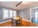 Comfortable dining area with table and chairs next to large windows and hardwood floors at 904 E Patterson St, Tampa, FL 33604