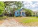 Quaint blue home with well-maintained landscaping, driveway and a cozy, inviting curb appeal at 904 E Patterson St, Tampa, FL 33604
