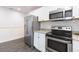 Modern kitchen features stainless steel appliances, granite counters, and white cabinetry at 904 E Patterson St, Tampa, FL 33604