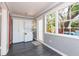 Laundry room features dark floors, three windows, washer dryer, and a door at 904 E Patterson St, Tampa, FL 33604
