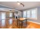 Open living and dining area boasts hardwood floors, fireplace and neutral paint at 904 E Patterson St, Tampa, FL 33604