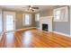 Hardwood floors, neutral paint and fireplace features in this comfortable living room at 904 E Patterson St, Tampa, FL 33604