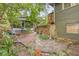 A landscaped backyard featuring a brick walkway and tropical foliage at 916 E Broad St, Tampa, FL 33604