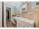 Classic bathroom featuring stylish vanity and a view to the hallway at 916 E Broad St, Tampa, FL 33604