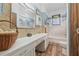 Charming bathroom featuring a vanity, classic tile and shower-tub at 916 E Broad St, Tampa, FL 33604