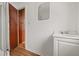 Bathroom featuring a corner shower, a vanity with sink, and wood paneled door at 916 E Broad St, Tampa, FL 33604