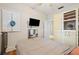 Cozy bedroom with a mounted TV and a built-in wardrobe at 916 E Broad St, Tampa, FL 33604