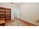Charming bedroom featuring a dark bookshelf and door to the hallway at 916 E Broad St, Tampa, FL 33604