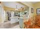 Open-concept kitchen featuring granite countertops, stainless steel appliances, kitchen island with breakfast bar at 916 E Broad St, Tampa, FL 33604