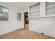 Bright kitchenette with a window, door, and built-in shelves at 916 E Broad St, Tampa, FL 33604