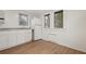 Bright kitchenette with a sink, base cabinets, and a full size refrigerator at 916 E Broad St, Tampa, FL 33604