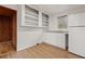 Bright kitchenette with a window, a sink with base cabinets, and a full size refrigerator at 916 E Broad St, Tampa, FL 33604