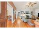 Bright living room showcasing hardwood floors, a fireplace, and seamlessly connects to other rooms, great for entertaining at 916 E Broad St, Tampa, FL 33604