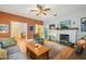 Cozy living room featuring hardwood floors, a decorative fireplace, and a comfortable seating area for relaxation at 916 E Broad St, Tampa, FL 33604
