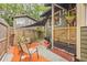 Back patio with sunshade and seating, ideal for relaxation and outdoor living at 916 E Broad St, Tampa, FL 33604