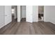 Bedroom with modern floors that opens to closet, bath, and other rooms at 9816 Crofton Ln, Port Richey, FL 34668