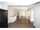 Spacious living area flows into the kitchen, featuring laminate flooring throughout at 9816 Crofton Ln, Port Richey, FL 34668