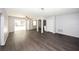 Open-concept living area with hard floors, plenty of natural light, and modern fixtures at 9816 Crofton Ln, Port Richey, FL 34668