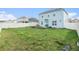Backyard featuring a green lawn, patio, and white fence at 3509 San Moise St, Plant City, FL 33567