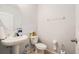Simple bathroom featuring a pedestal sink, toilet, and neutral wall color at 3509 San Moise St, Plant City, FL 33567