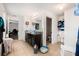 Bathroom featuring double vanity with tile flooring, toilet, and storage shelves at 3509 San Moise St, Plant City, FL 33567