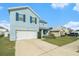 Two-story home with a spacious driveway and well-maintained lawn at 3509 San Moise St, Plant City, FL 33567