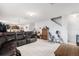 Spacious living area with neutral tile flooring and a comfortable leather sofa at 3509 San Moise St, Plant City, FL 33567