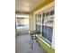 Relaxing front porch with table and view of the yard, perfect for morning coffee at 10411 Summerview Cir, Riverview, FL 33578