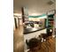 Modern kitchen featuring stainless steel appliances, white cabinets, and breakfast bar at 10411 Summerview Cir, Riverview, FL 33578