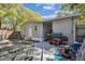 Backyard area featuring a patio and lawnmower at 10501 Bay Hills Cir, Thonotosassa, FL 33592