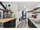 Bright kitchen with white appliances, dark cabinets, butcher block, and open shelving at 10501 Bay Hills Cir, Thonotosassa, FL 33592